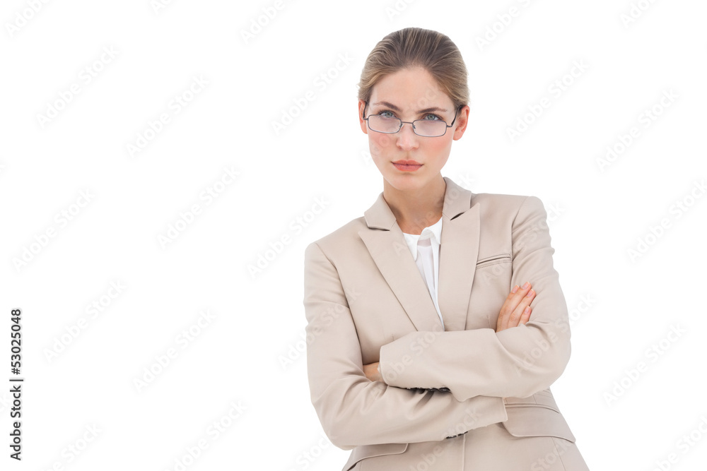 Businesswoman looking at the camera with arms crossed Businesswoman looking at the camera with arms crossed
