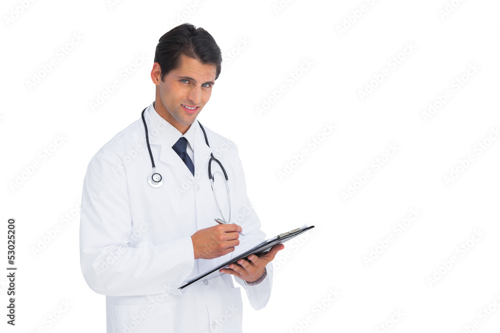 Young doctor holding a clipboard and pen Young doctor holding a clipboard and pen