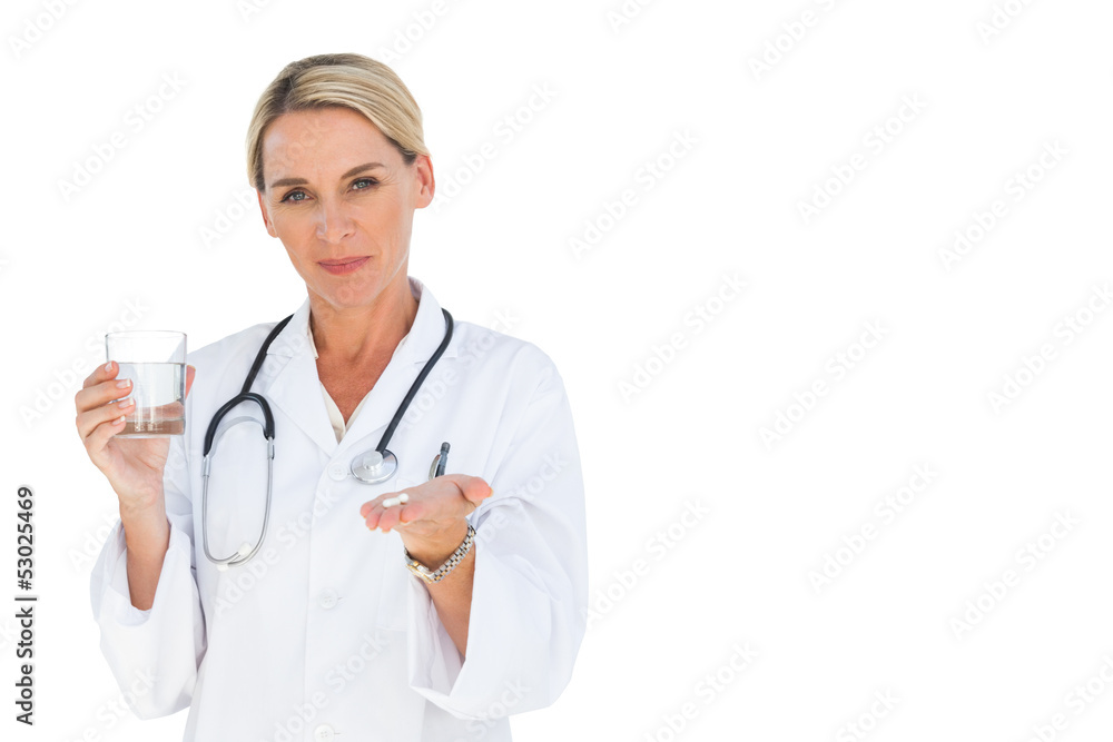 Happy doctor holding out drugs and water glass Happy doctor holding out drugs and water glass