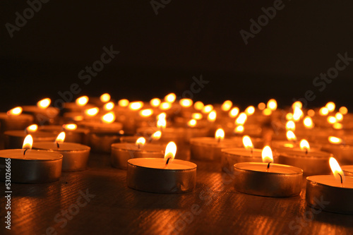 Burning candles on dark background
