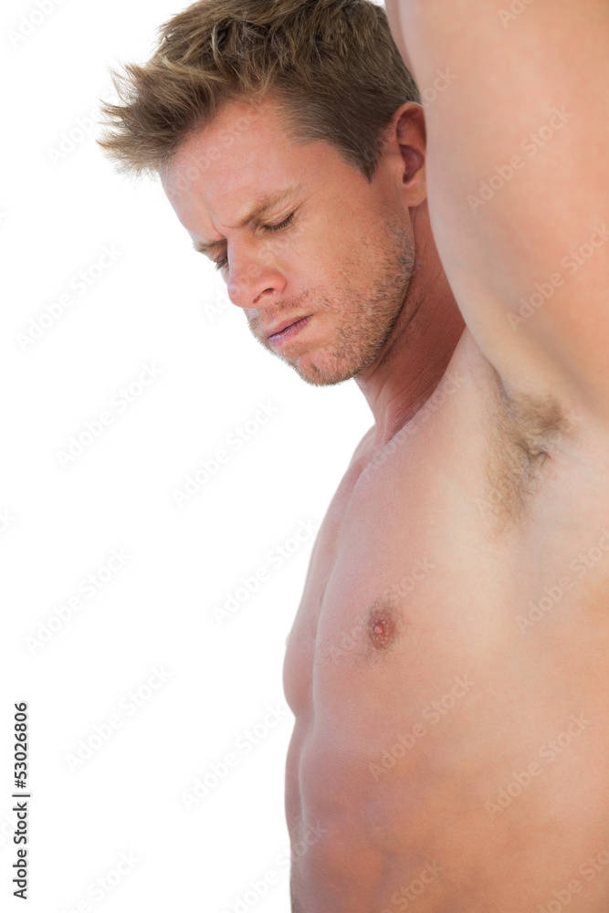 Attractive man with shorts suffering from neck pain Attractive man with shorts suffering from neck pain