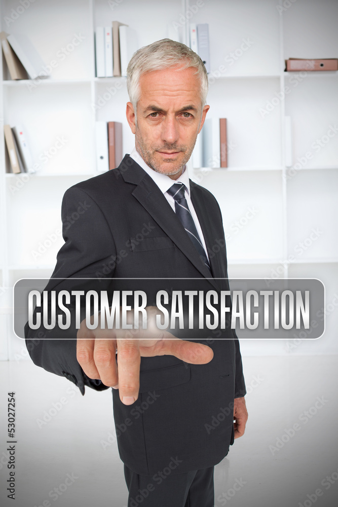 Businessman selecting the term customer satisfaction Businessman selecting the term customer satisfaction