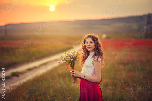 The girl in a poppy field