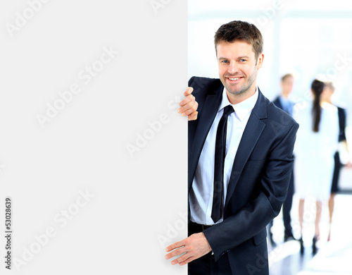 Business man holding a long blank banner