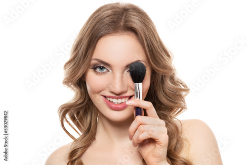 Portrait of a smiling woman with brush isolated