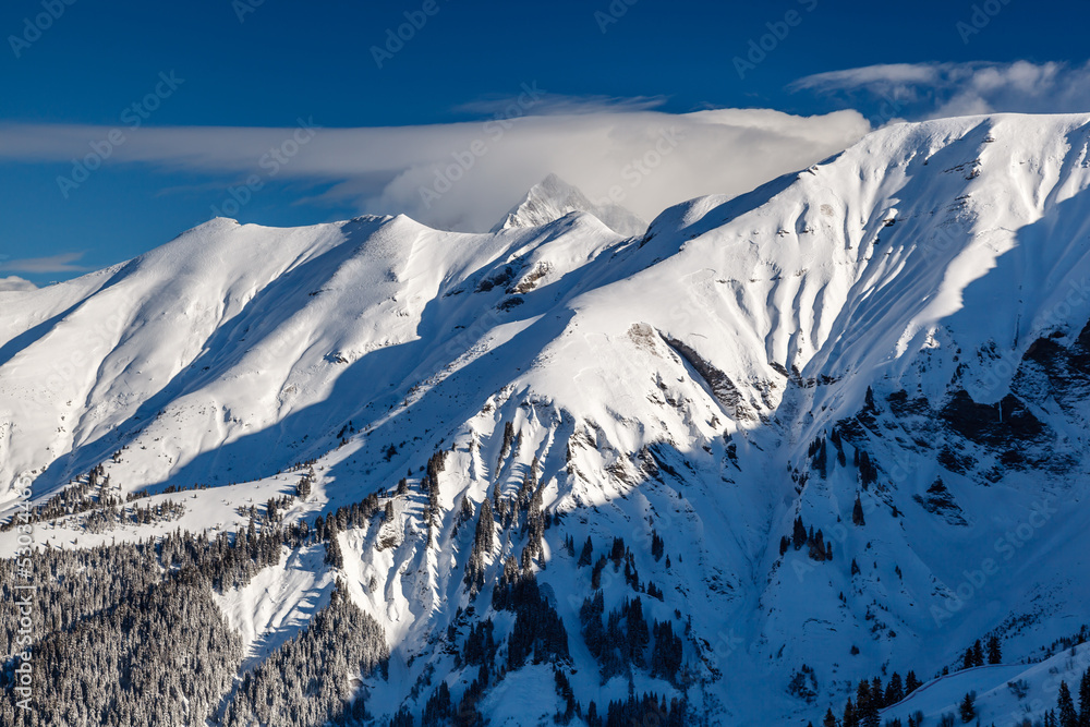 Mountain Peak and Ski Slope near Megeve in French Alps, France Mountain Peak and Ski Slope near Megeve in French Alps, France