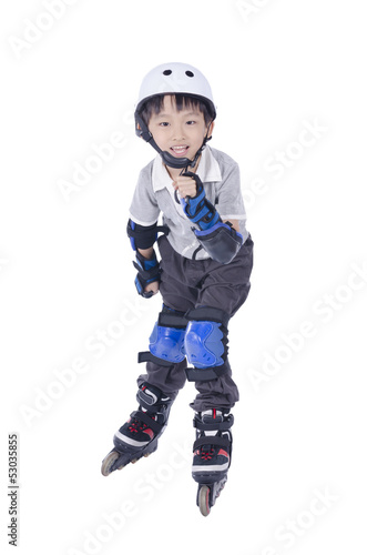 Smart boy playing roller blades over white background © Franky