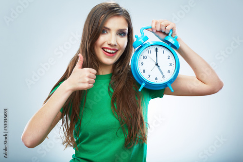 Young smiling woman hold watch. Beautiful smiling girl portrait