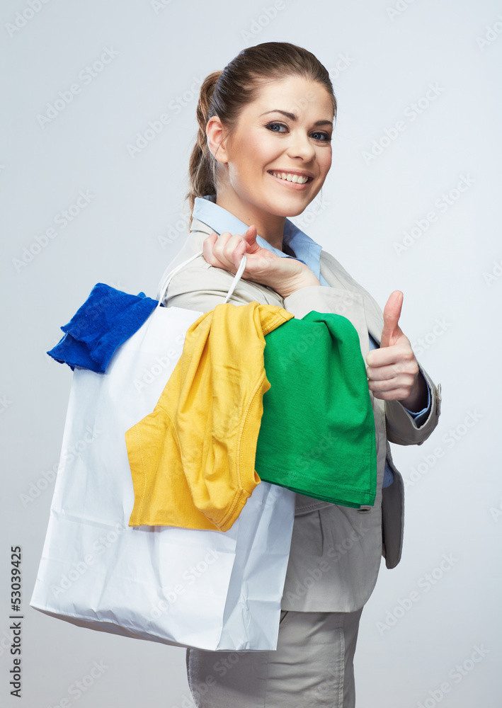 Business woman hold white shopping bag turned back. Business woman hold white shopping bag turned back.