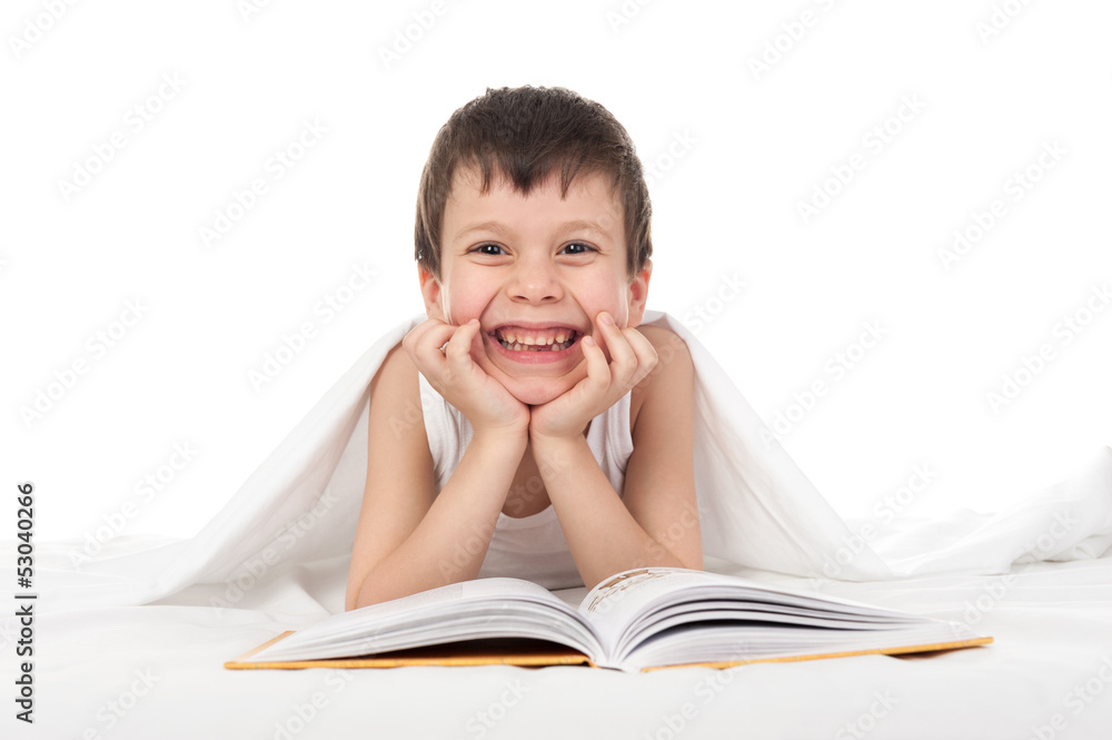 boy read a book in bed boy read a book in bed