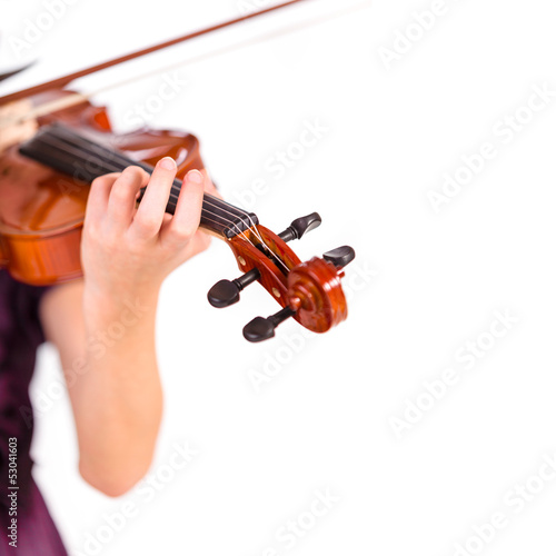 Young girl practicing the violin. Over white background.