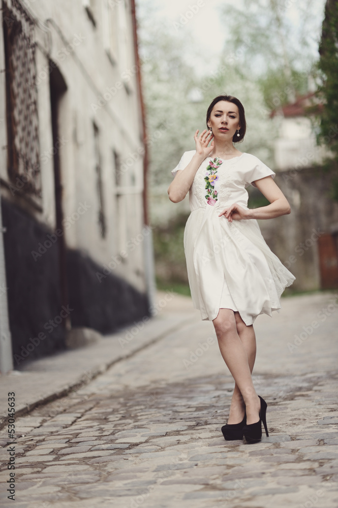 Cute girl posing on a city street Cute girl posing on a city street