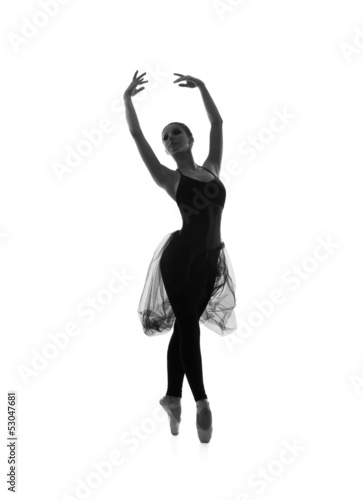 Silhouette of a young female ballet dancer on white photo