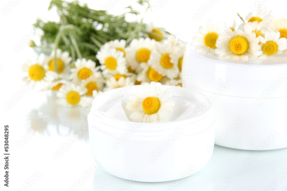 Cream with chamomile isolated on white Cream with chamomile isolated on white