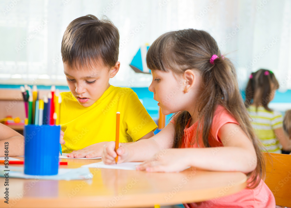 Group of cute little prescool kids drawing Group of cute little prescool kids drawing