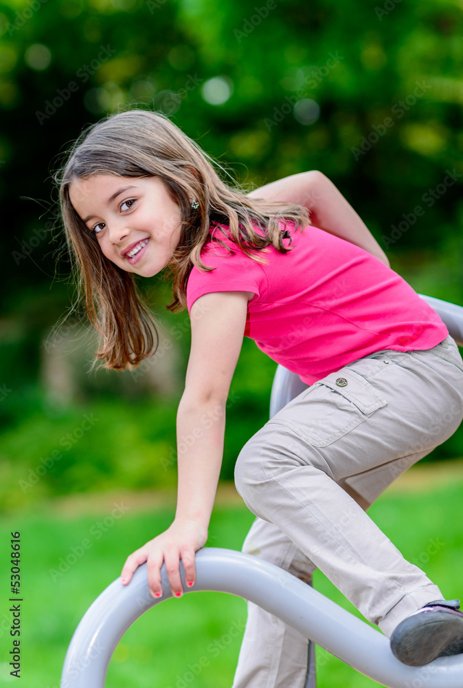 pretty little girl on a playground pretty little girl on a playground
