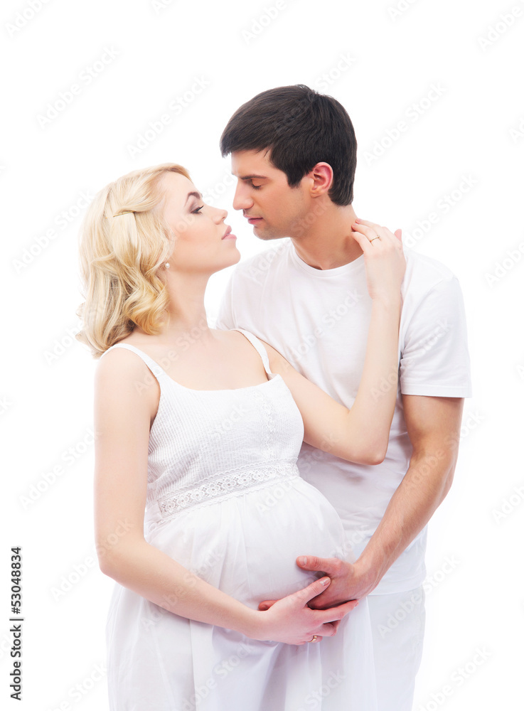 A young and attractive couple: pregnant mother and happy father