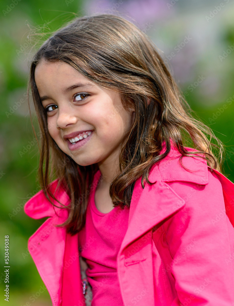 Fototapeta premium Natural portrait of a happy pretty little girl