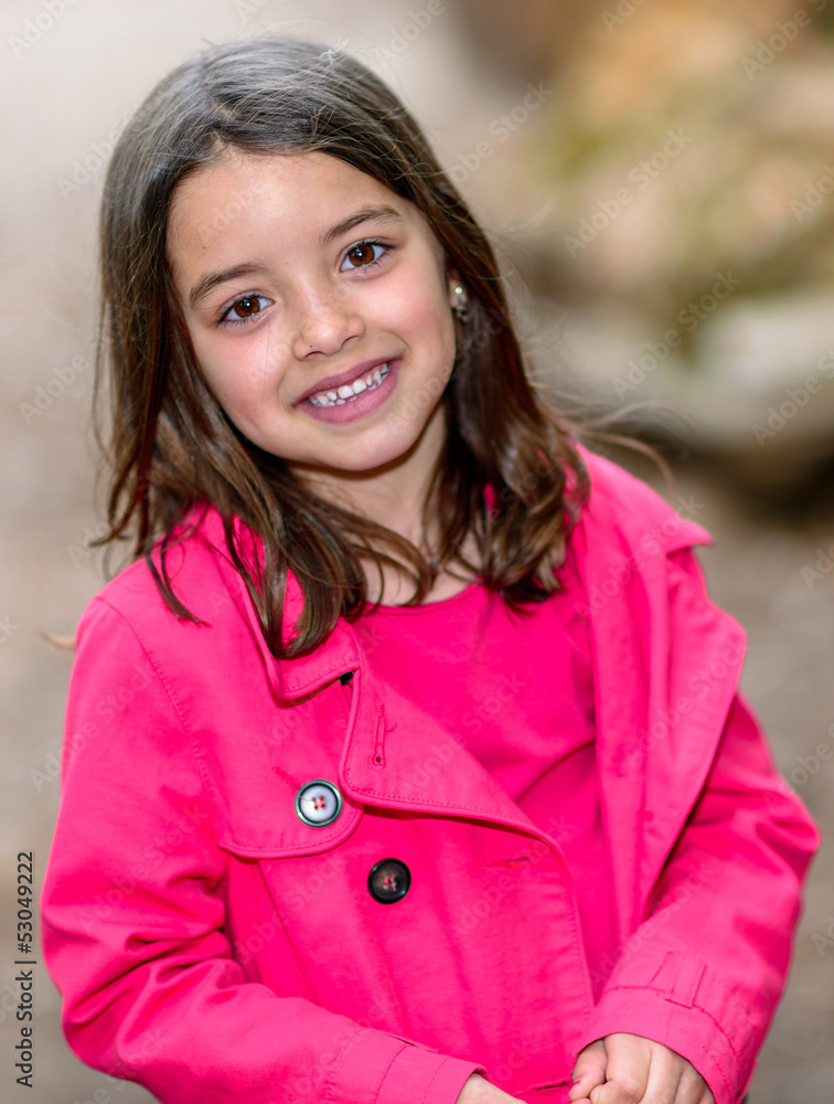 happy cute child standing in a park happy cute child standing in a park