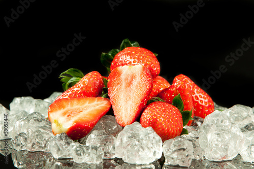 strawberry on the ice on black background