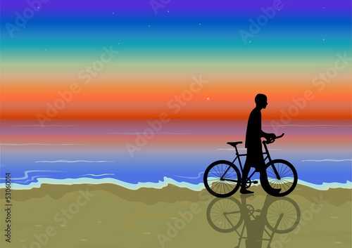 bike nea the beach at sunset