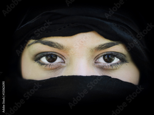 Portrait of beautiful Arab woman wearing black scarf