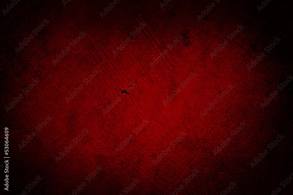 Fototapeta premium Red textured concrete wall background. Dark edges