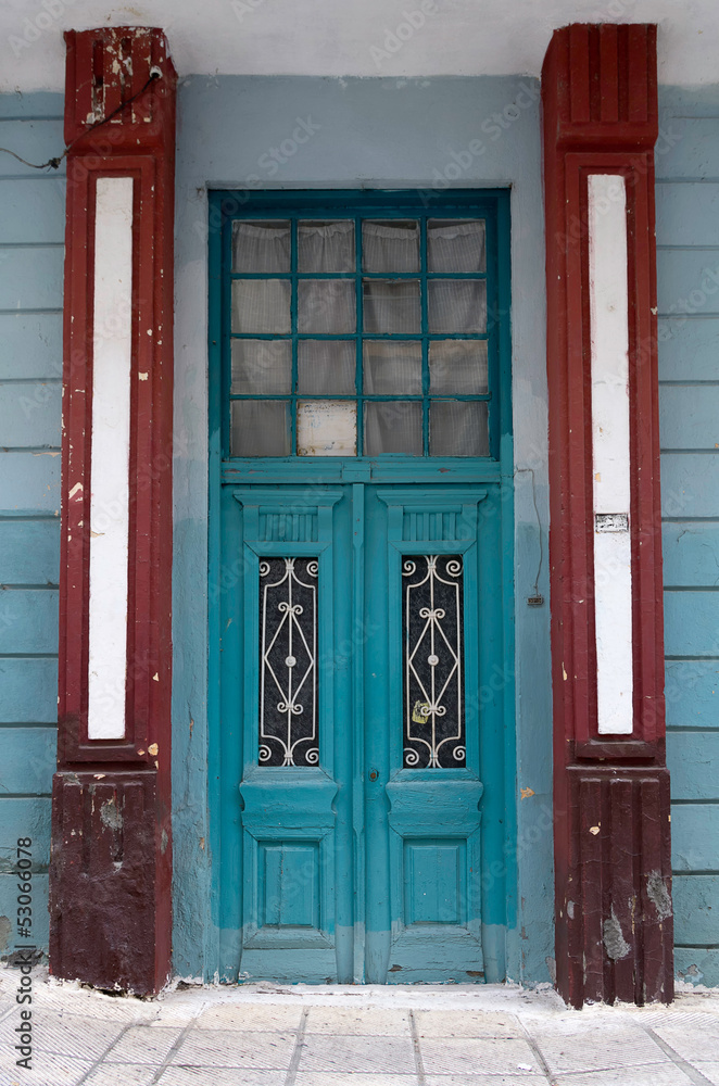 Old door to a neoclassical building Old door to a neoclassical building
