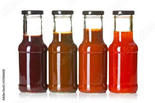 various barbecue sauces in glass bottles