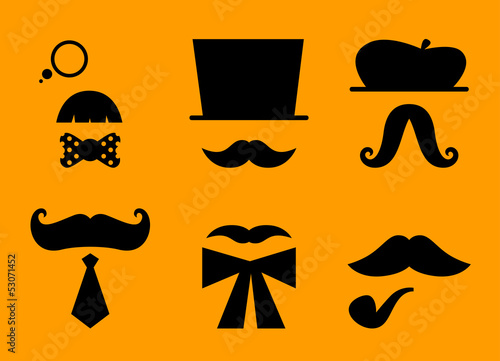 Mustaches and hats retro accessories isolated on orange photo