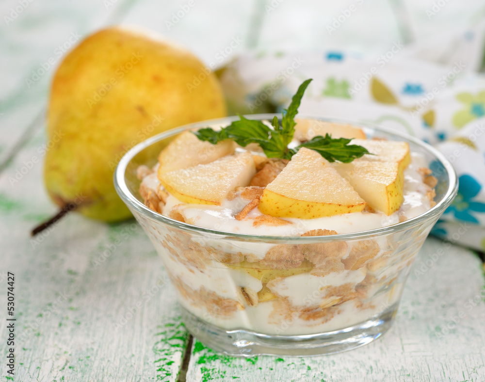 Dessert of muesli and yogurt with pear Dessert of muesli and yogurt with pear