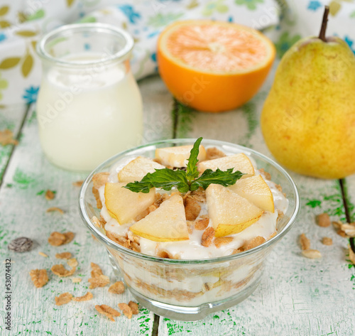 Dessert of muesli and yogurt with pear