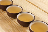 Chinese traditional teacups with green tea close up