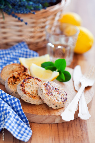 Chicken cutlets with lemon, selective focus