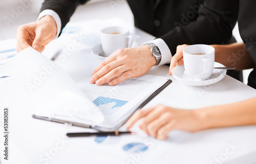 woman hand signing contract paper
