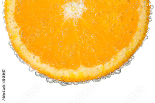 Orange Slice in Clear Fizzy Water Bubble Background