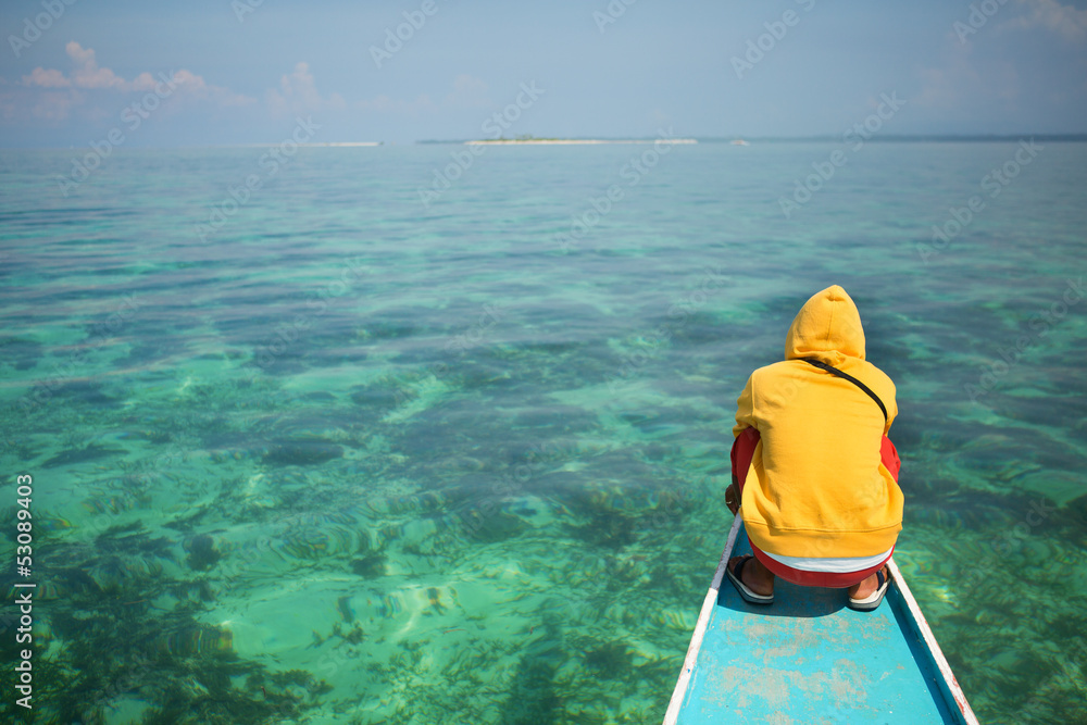 Philippino man on a nose of bangka boat Philippino man on a nose of bangka boat