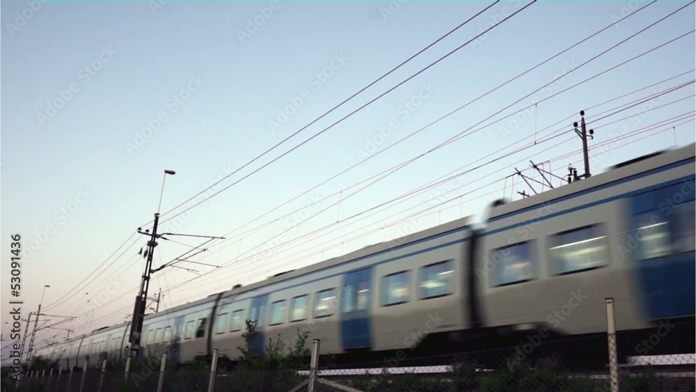 blue and white train passing at high speed blue and white train passing at high speed
