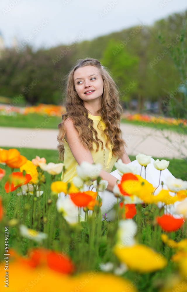 Girl with beautiful orange and yellow poppies Girl with beautiful orange and yellow poppies