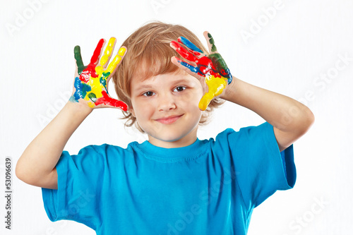 Little cute boy with painted hands on a white background