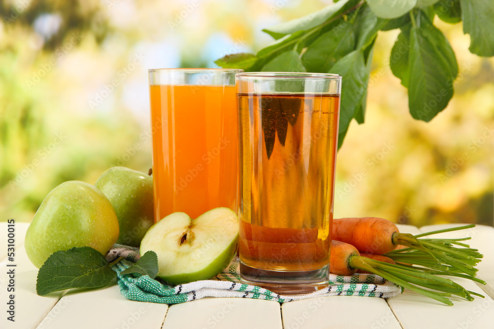 Glasses of juice, apples and carrots Glasses of juice, apples and carrots
