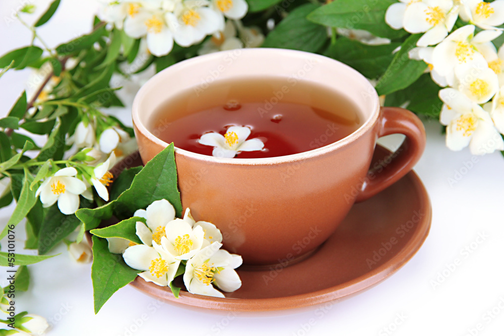 Cup of tea with jasmine, isolated on white Cup of tea with jasmine, isolated on white