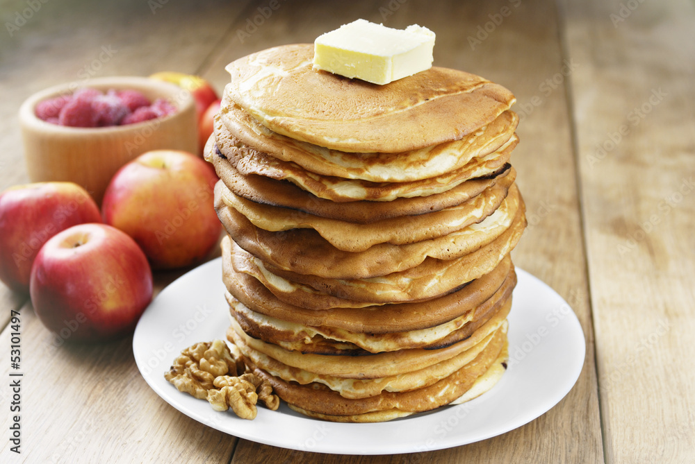 Pile of pancakes in the white plate Pile of pancakes in the white plate