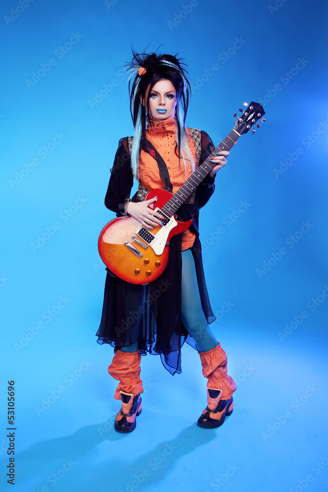 Rock girl posing with electric guitar playing hard-rock isolated Rock girl posing with electric guitar playing hard-rock isolated