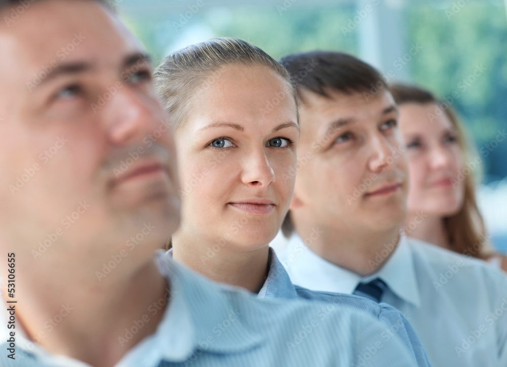 Happy smiling business team standing in a row at office Happy smiling business team standing in a row at office