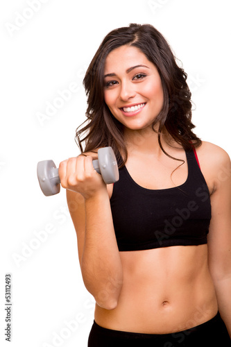 Beautiful fitness woman lifting weights