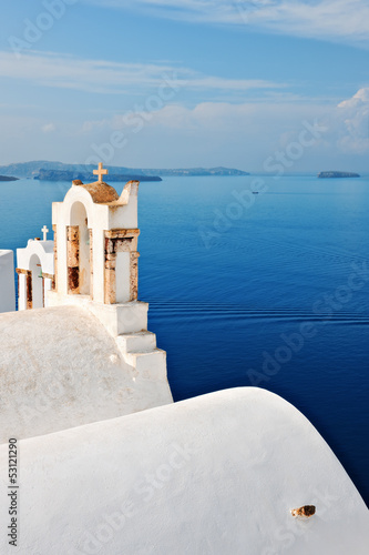 Bell towers overlooking the sea in Oia