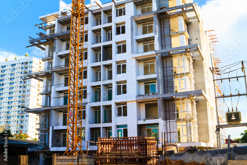 Apartments construction site with yellow crane