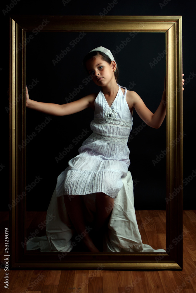 Young girl with golden frame
