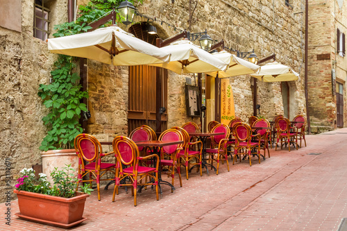 Small cafe on the corner of the old city in Italy #53132671